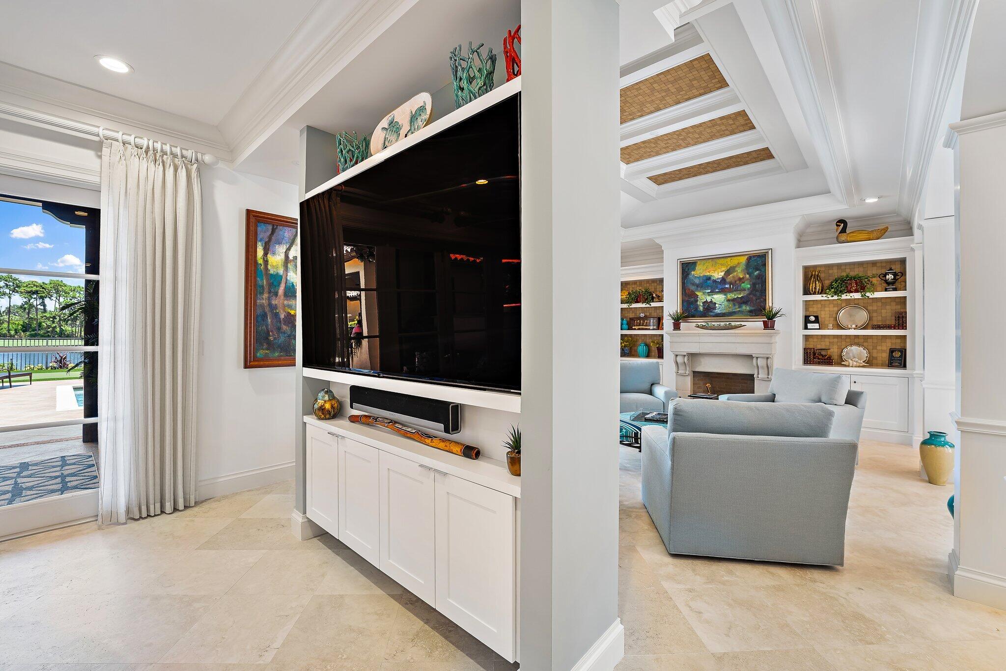 438 Red Hawk Drive Jupiter, FL 33477 - Photo 68 of 116 a living room with furniture and a flat screen tv