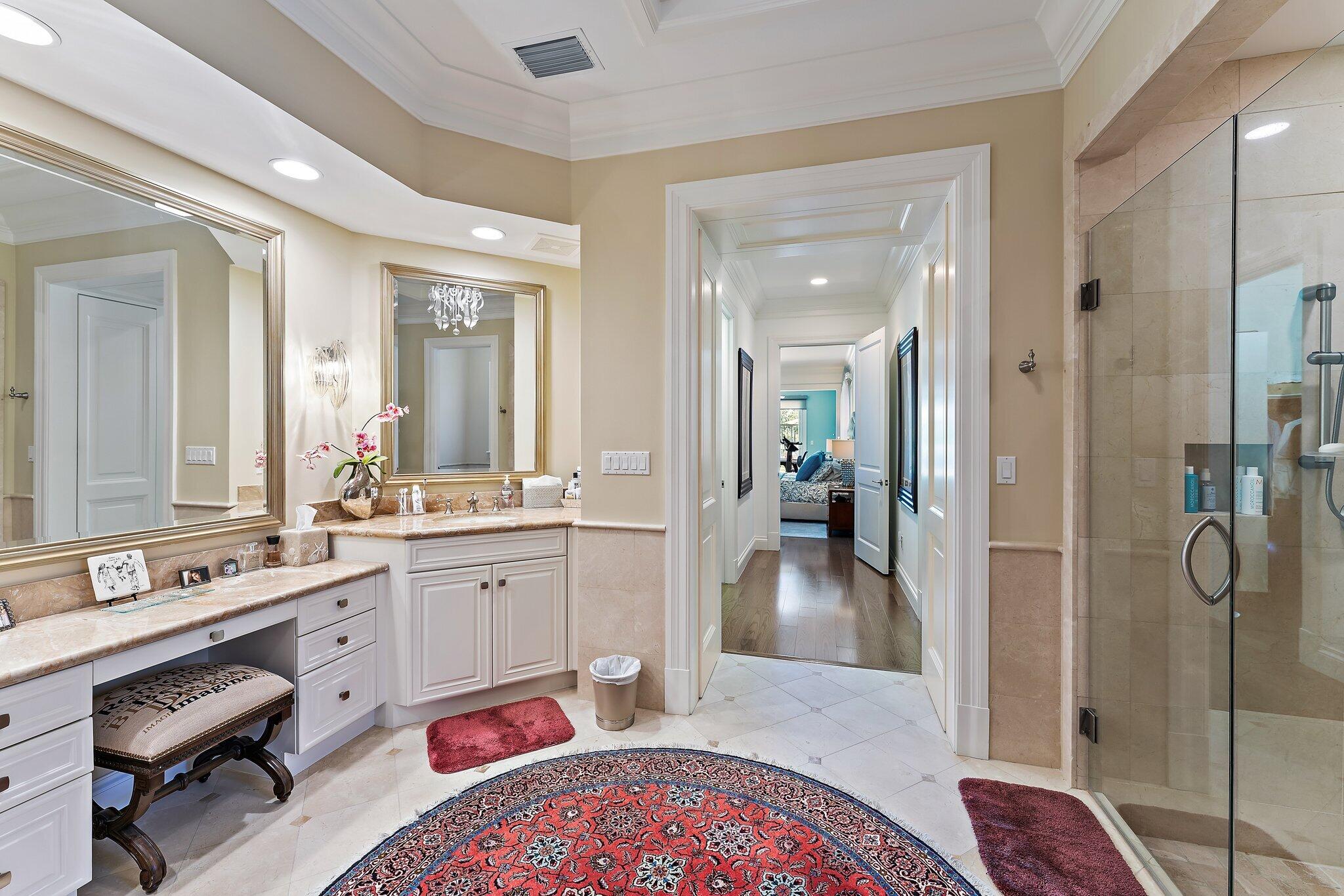438 Red Hawk Drive Jupiter, FL 33477 - Photo 82 of 116 a en suite bathroom with a granite countertop sink and a mirror