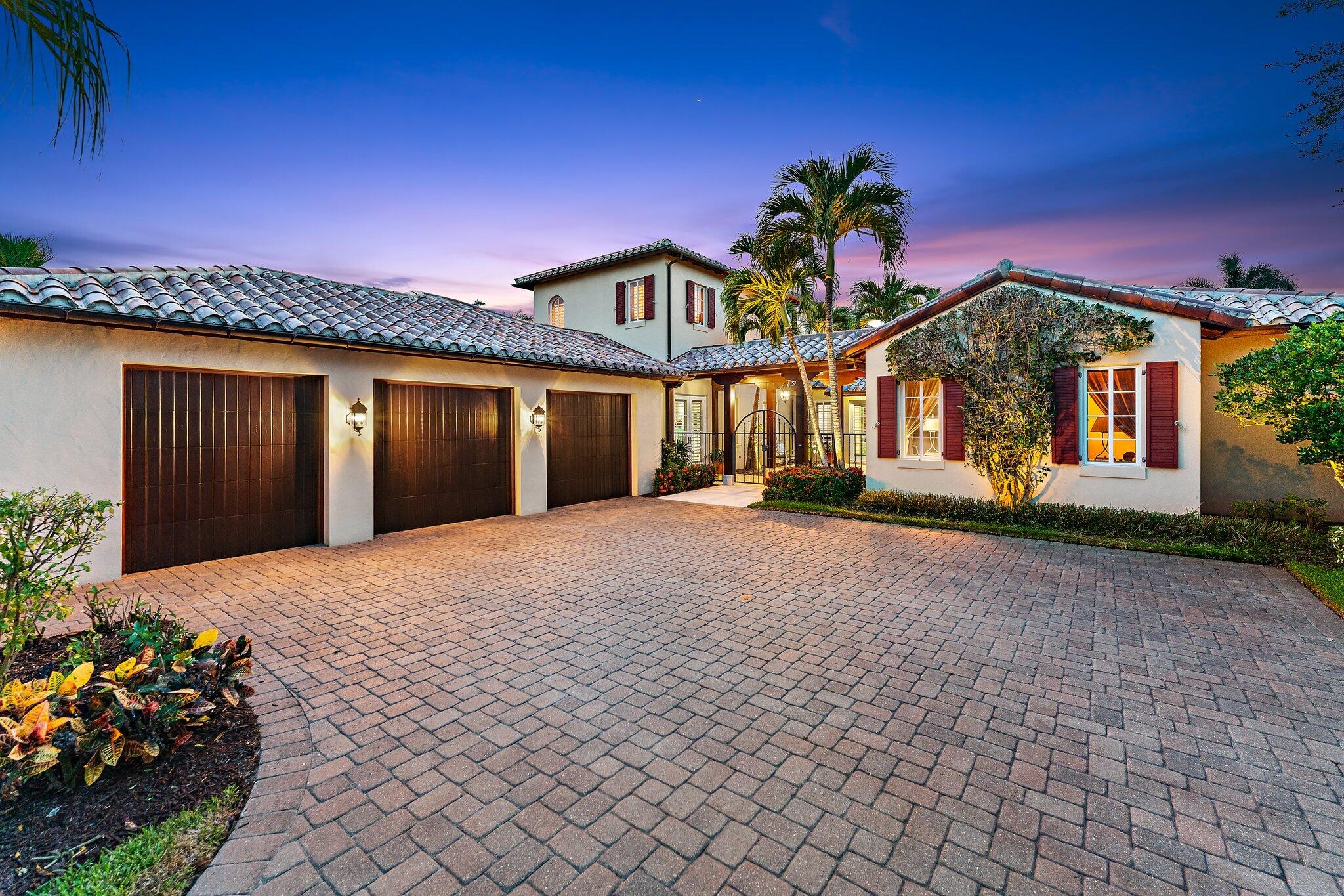 438 Red Hawk Drive Jupiter, FL 33477 - Photo 9 of 116 a front view of a house with a yard