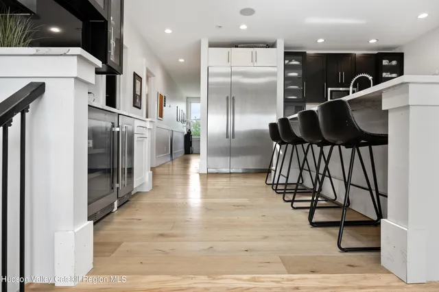 a kitchen with sink stove and cabinets