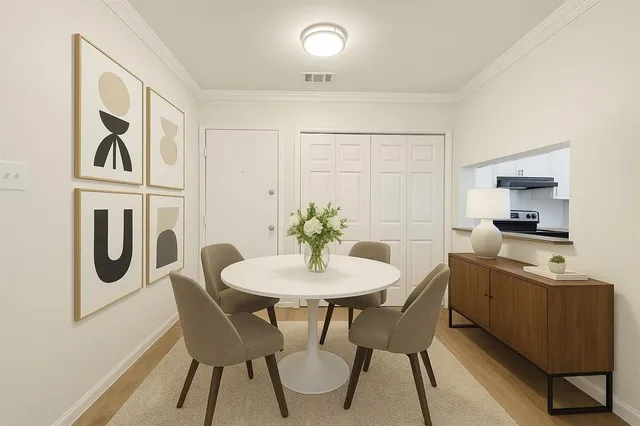 a view of a dining room with furniture window and wooden floor