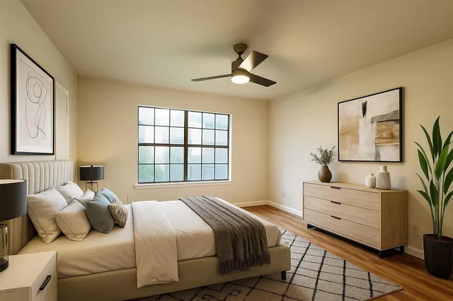 a bedroom with a bed and a dresser