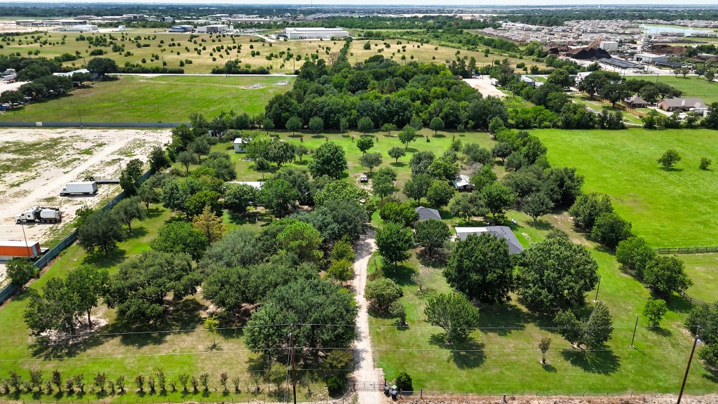 an aerial view of a houses with outdoor space and street view