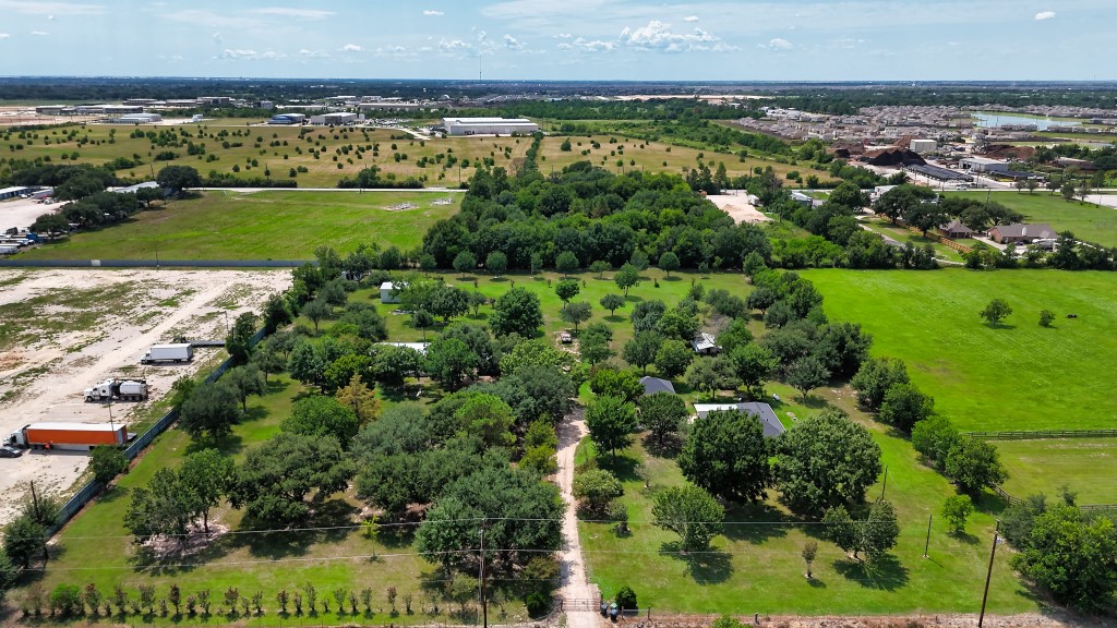 4249 Roland Road Katy, TX 77493 - Photo 11 of 12 an aerial view of a residential houses with outdoor space and trees all around