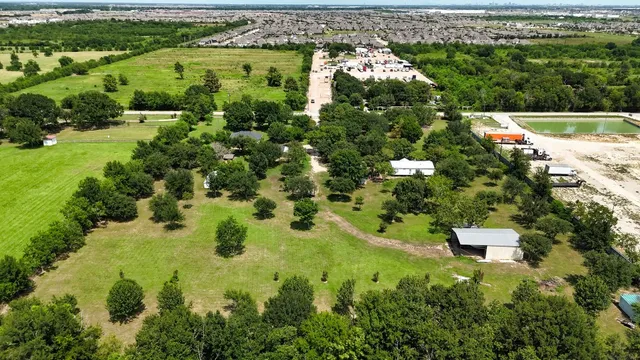 an aerial view of residential house with outdoor space