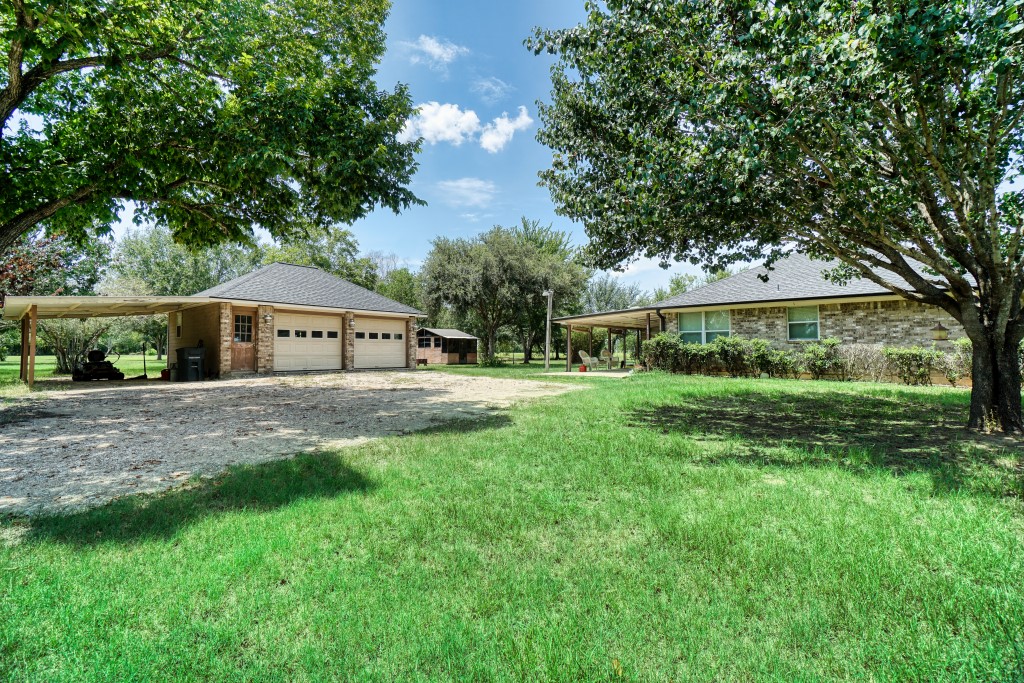 4249 Roland Road Katy, TX 77493 - Photo 6 of 12 a front view of house with yard and green space