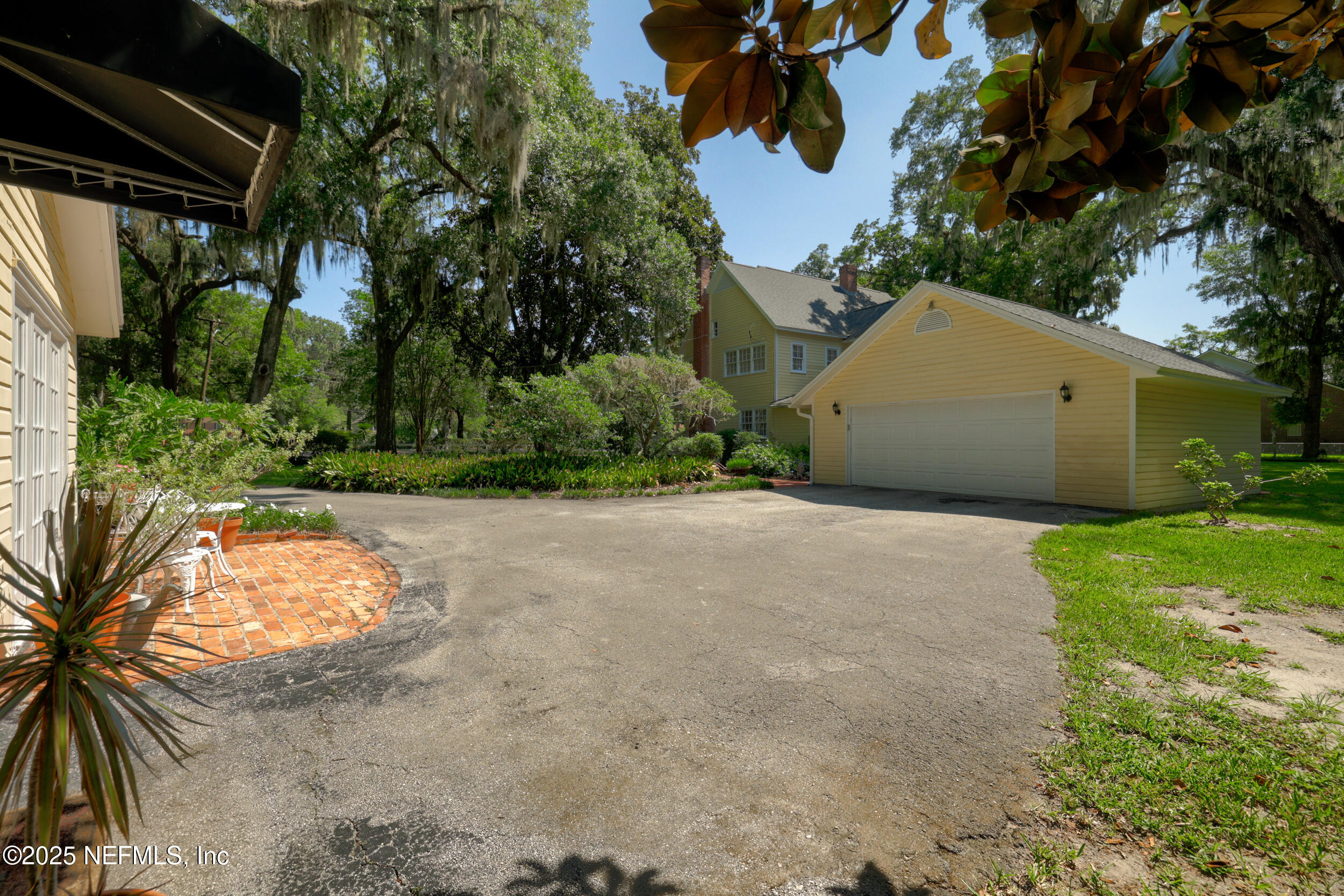 12367 Mandarin Road Jacksonville, FL 32223 - Photo 114 of 114 a view of a house with a yard and a garage