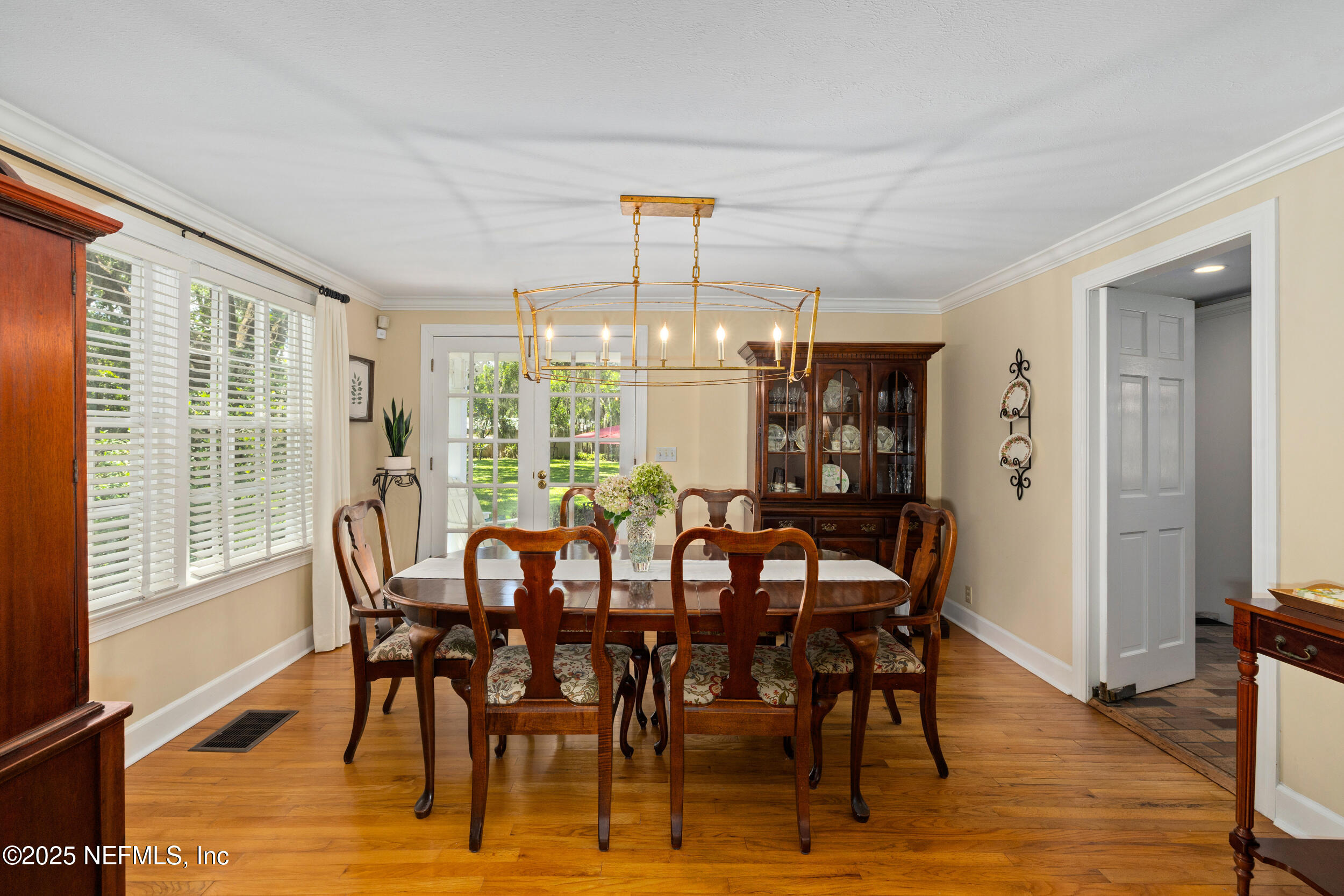 12367 Mandarin Road Jacksonville, FL 32223 - Photo 13 of 114 a view of a dining room with furniture window and wooden floor