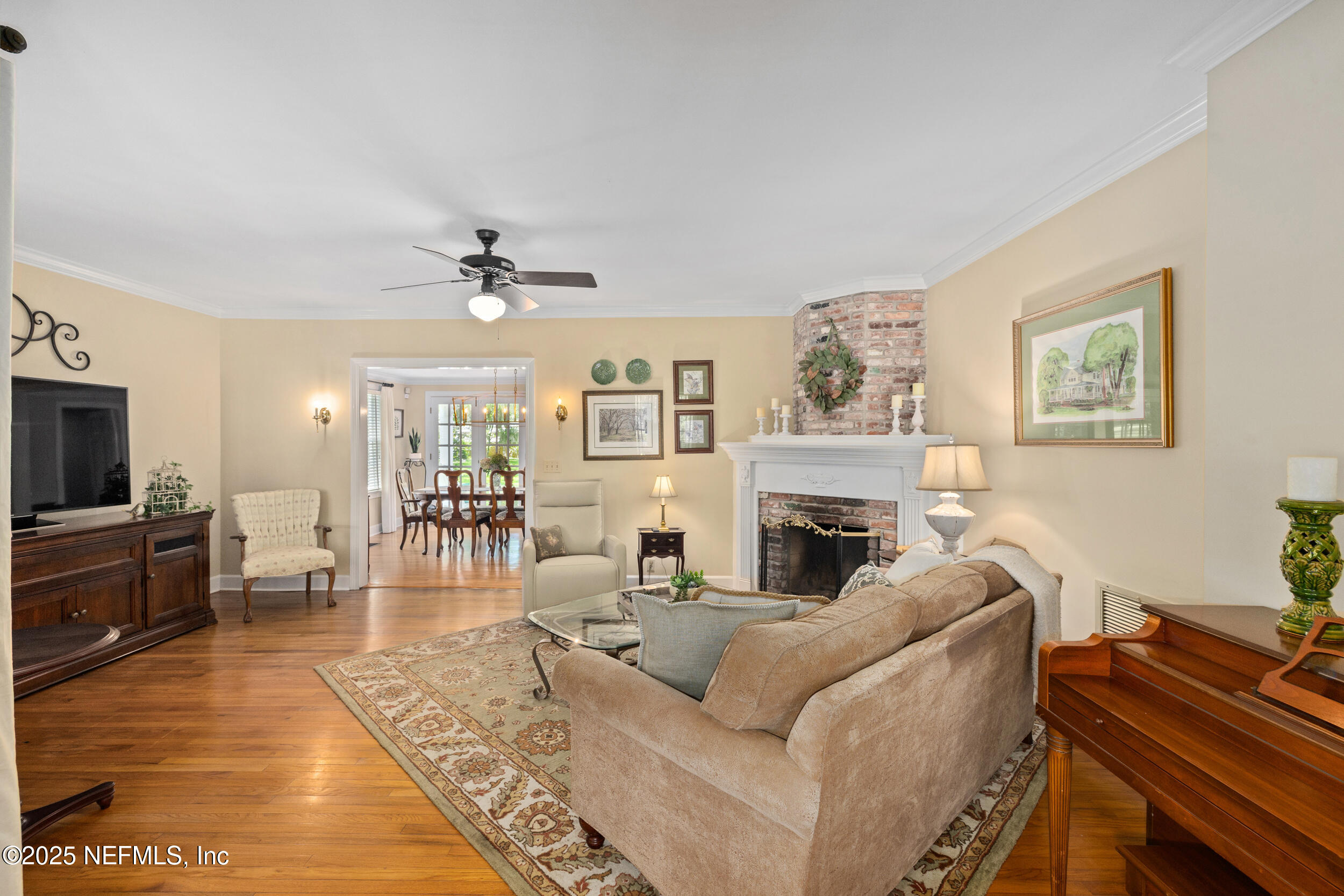 12367 Mandarin Road Jacksonville, FL 32223 - Photo 15 of 114 a living room with furniture a fireplace and a flat screen tv
