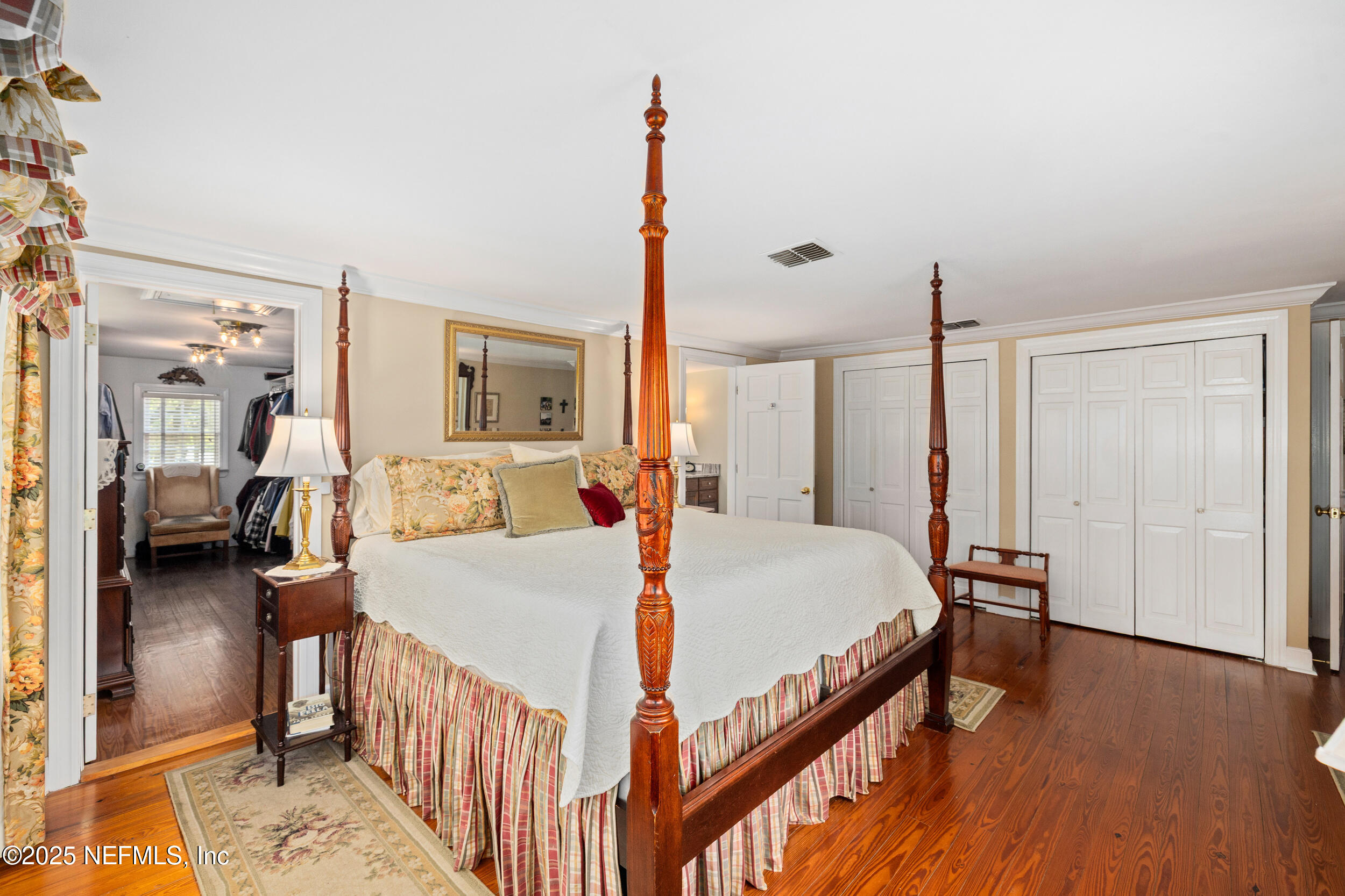 12367 Mandarin Road Jacksonville, FL 32223 - Photo 19 of 114 a bed room with a bed window and a walk in closet