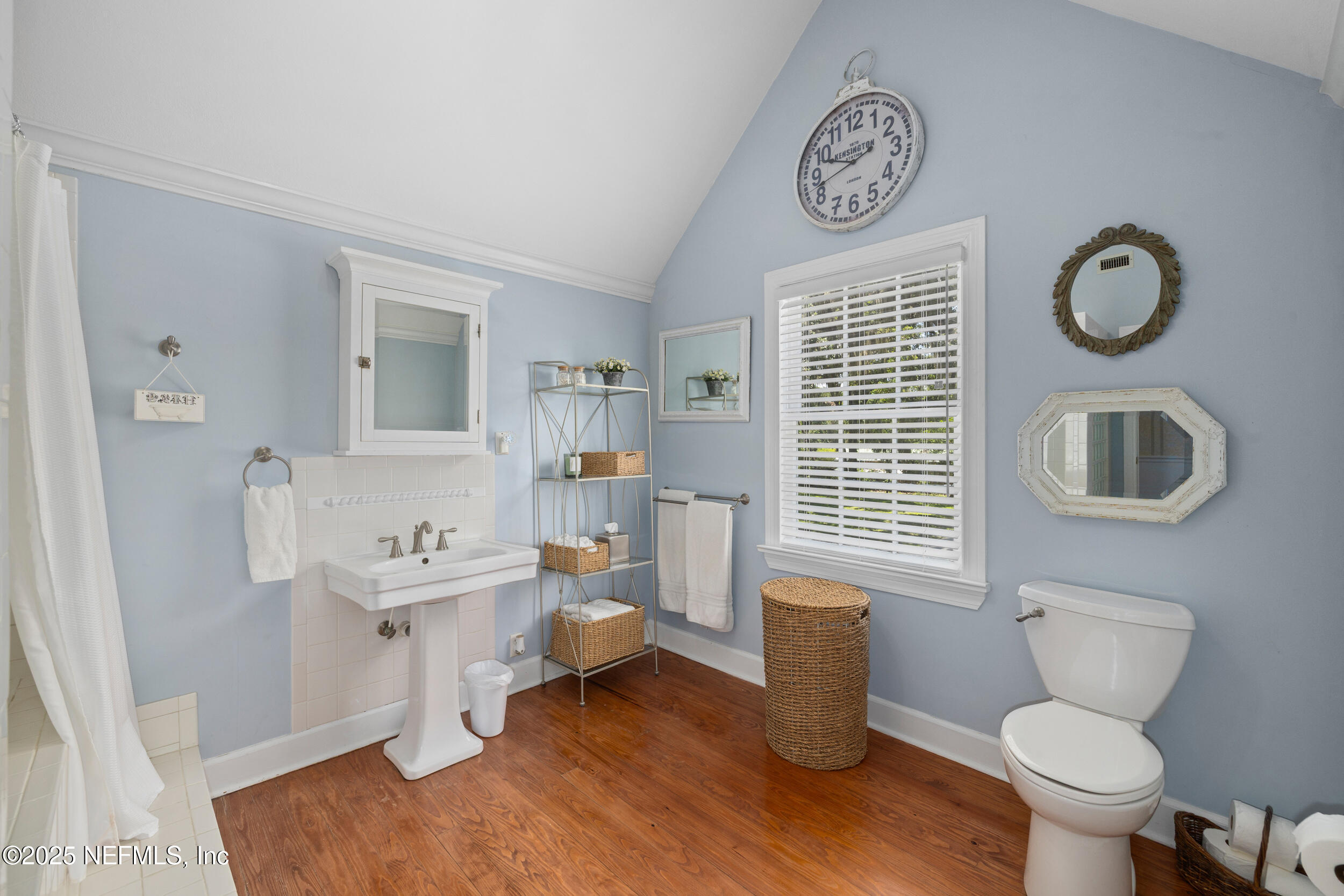 12367 Mandarin Road Jacksonville, FL 32223 - Photo 26 of 114 a bathroom with a toilet a sink and a mirror
