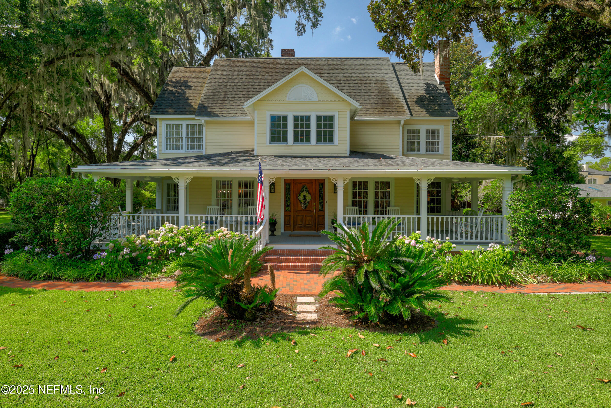 12367 Mandarin Road Jacksonville, FL 32223 - Photo 4 of 114 a front view of a house with a garden and plants