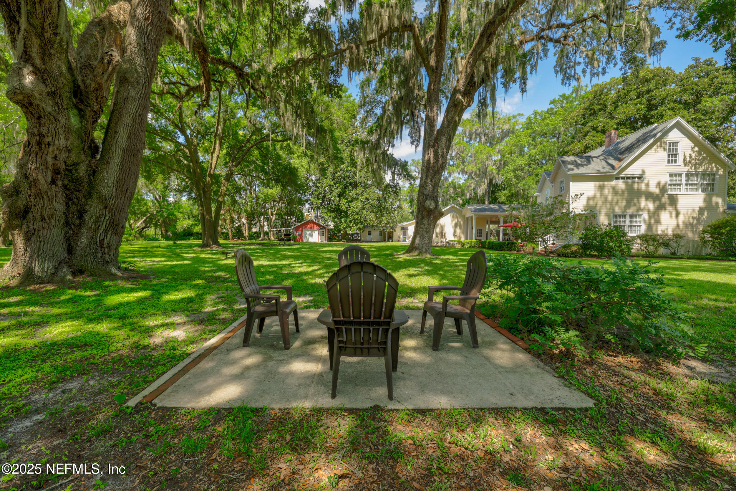 12367 Mandarin Road Jacksonville, FL 32223 - Photo 64 of 114 a view of a backyard with sitting area