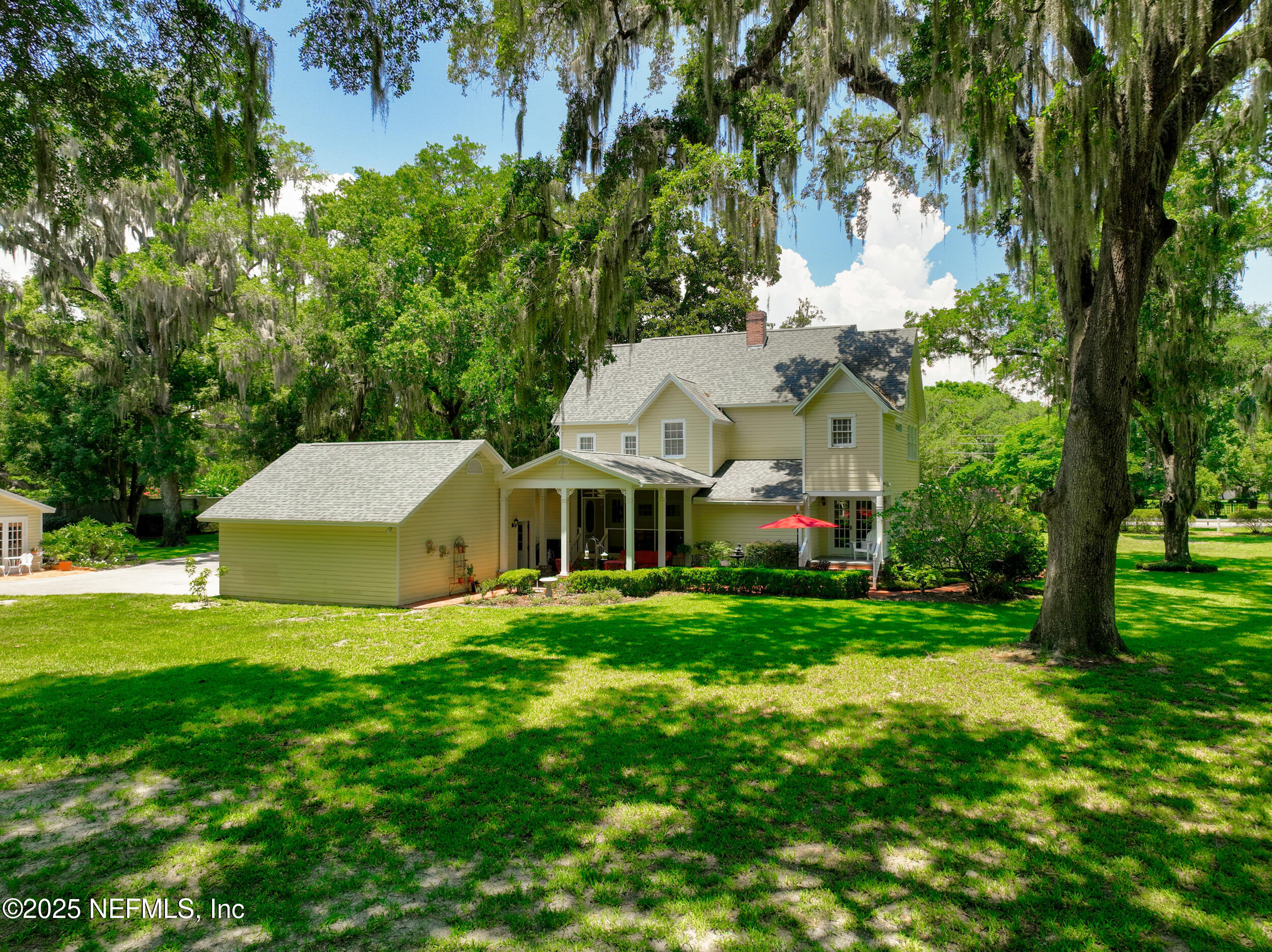 12367 Mandarin Road Jacksonville, FL 32223 - Photo 7 of 114 a view of a house with a big yard plants and large trees