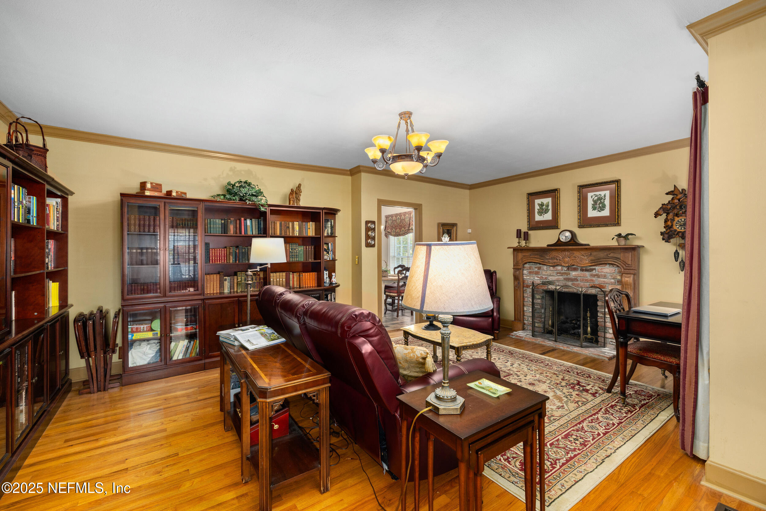 12367 Mandarin Road Jacksonville, FL 32223 - Photo 77 of 114 a living room with furniture a flat screen tv and a fireplace