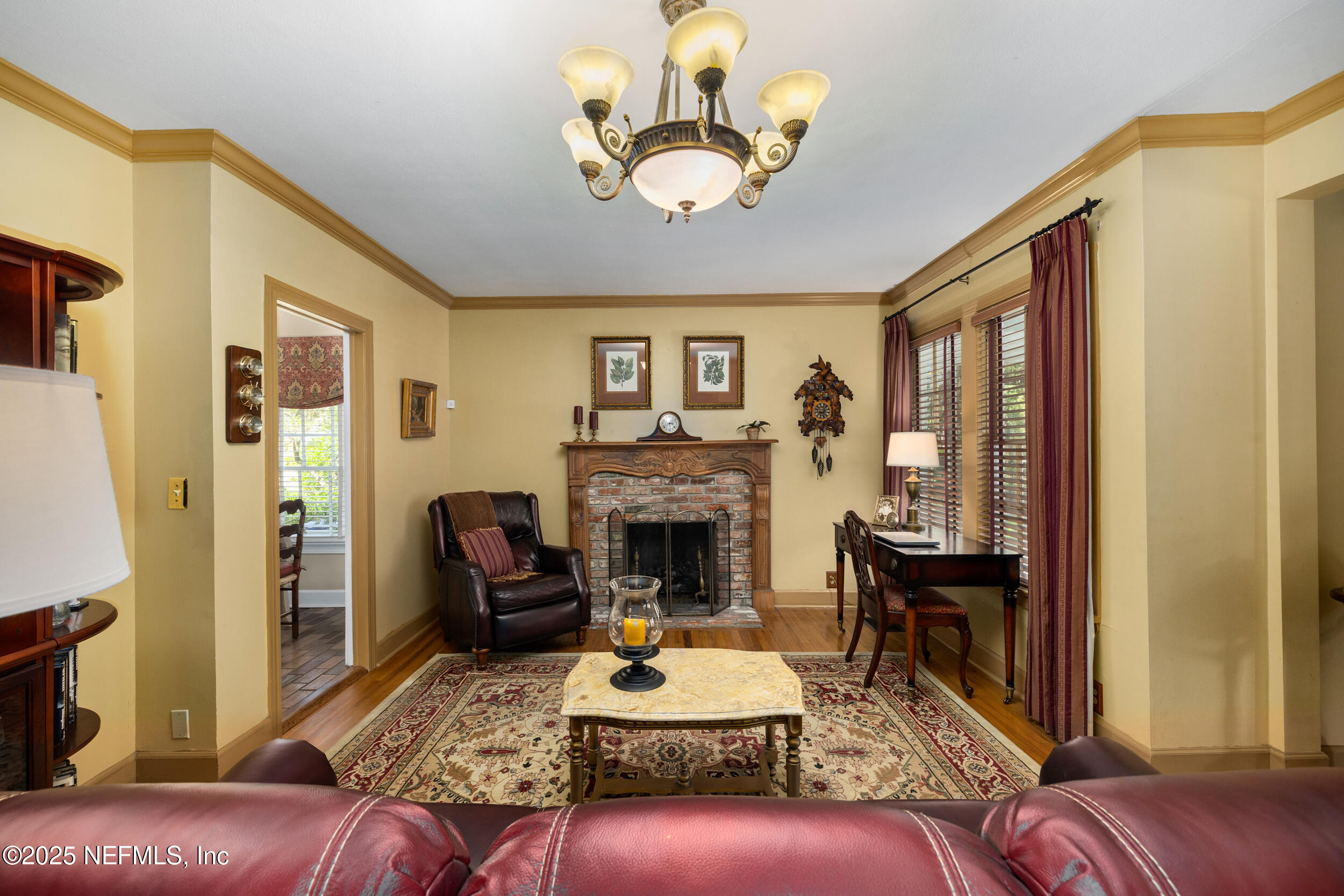 12367 Mandarin Road Jacksonville, FL 32223 - Photo 78 of 114 a living room with furniture a fireplace and a large mirror