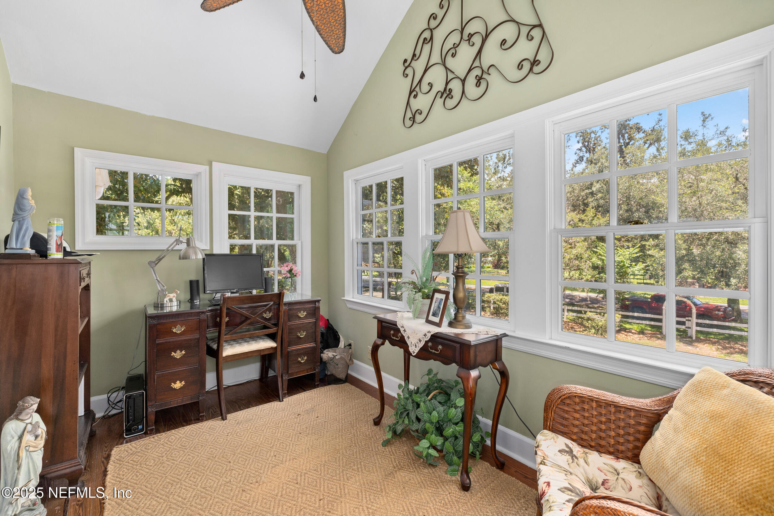 12367 Mandarin Road Jacksonville, FL 32223 - Photo 100 of 114 a living room with furniture and large windows