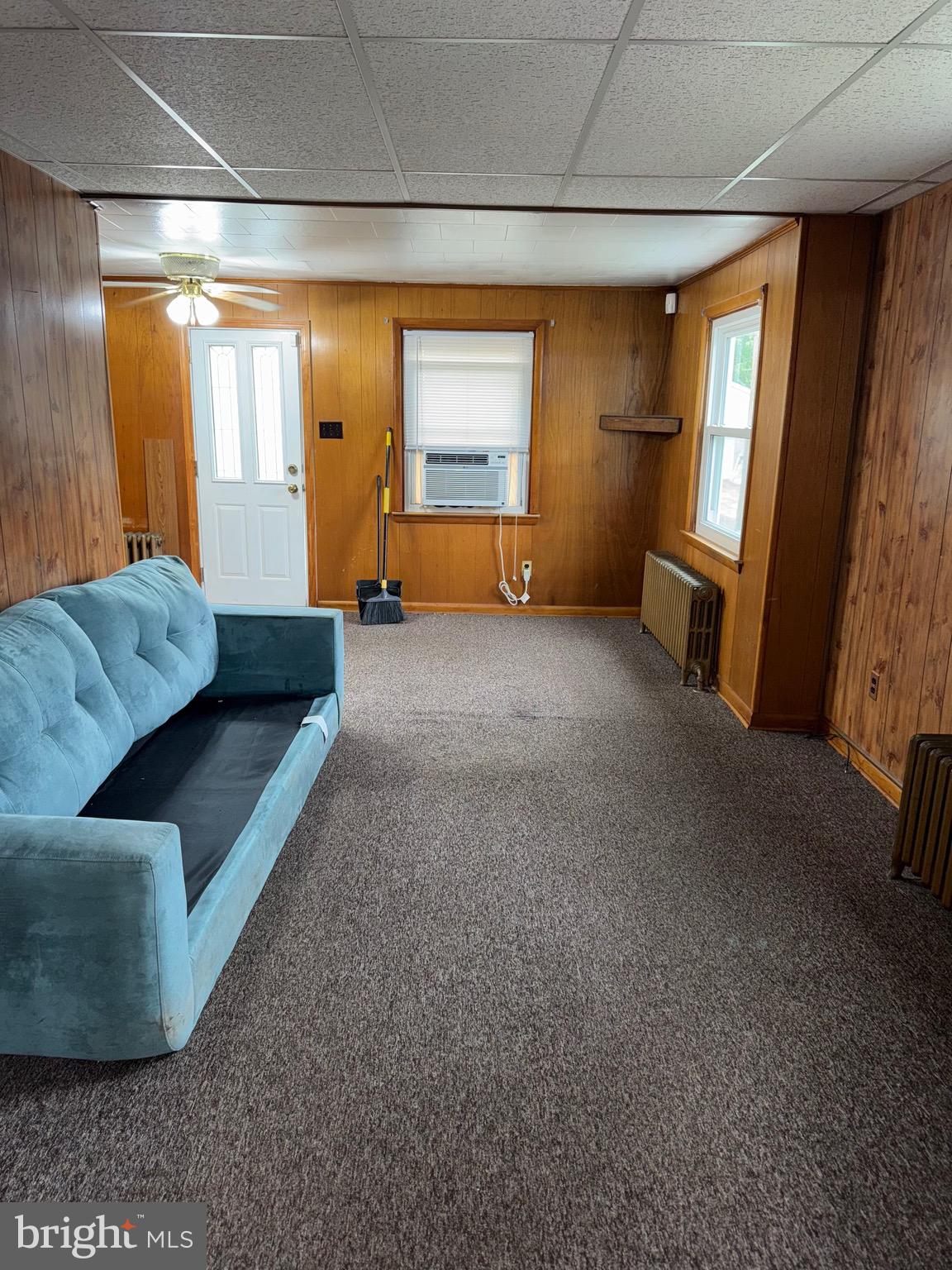 3021 Edgewood Avenue Baltimore, MD 21234 - Photo 2 of 10 a living room with furniture and a window
