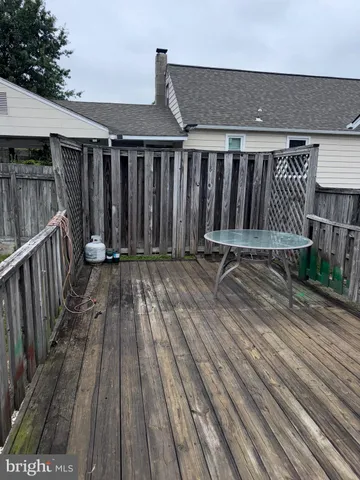 a view of a house with wooden deck