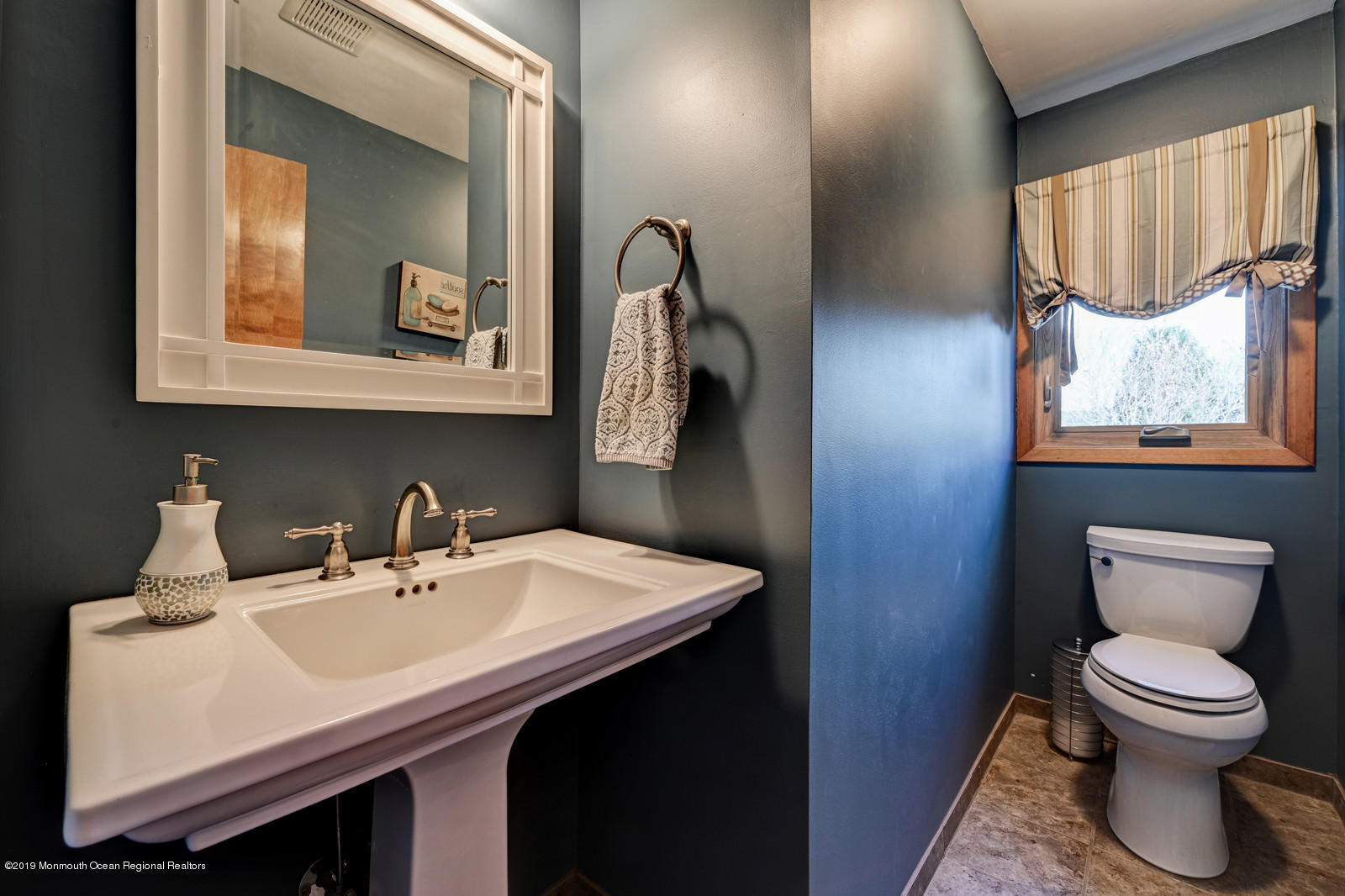 32 Hluchy Road Robbinsville, NJ 08691 - Photo 22 of 33 a bathroom with a toilet a sink and mirror