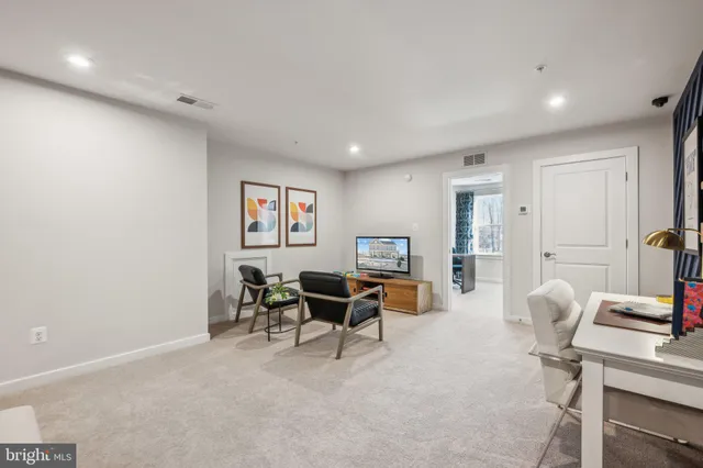 a work room with furniture and a window