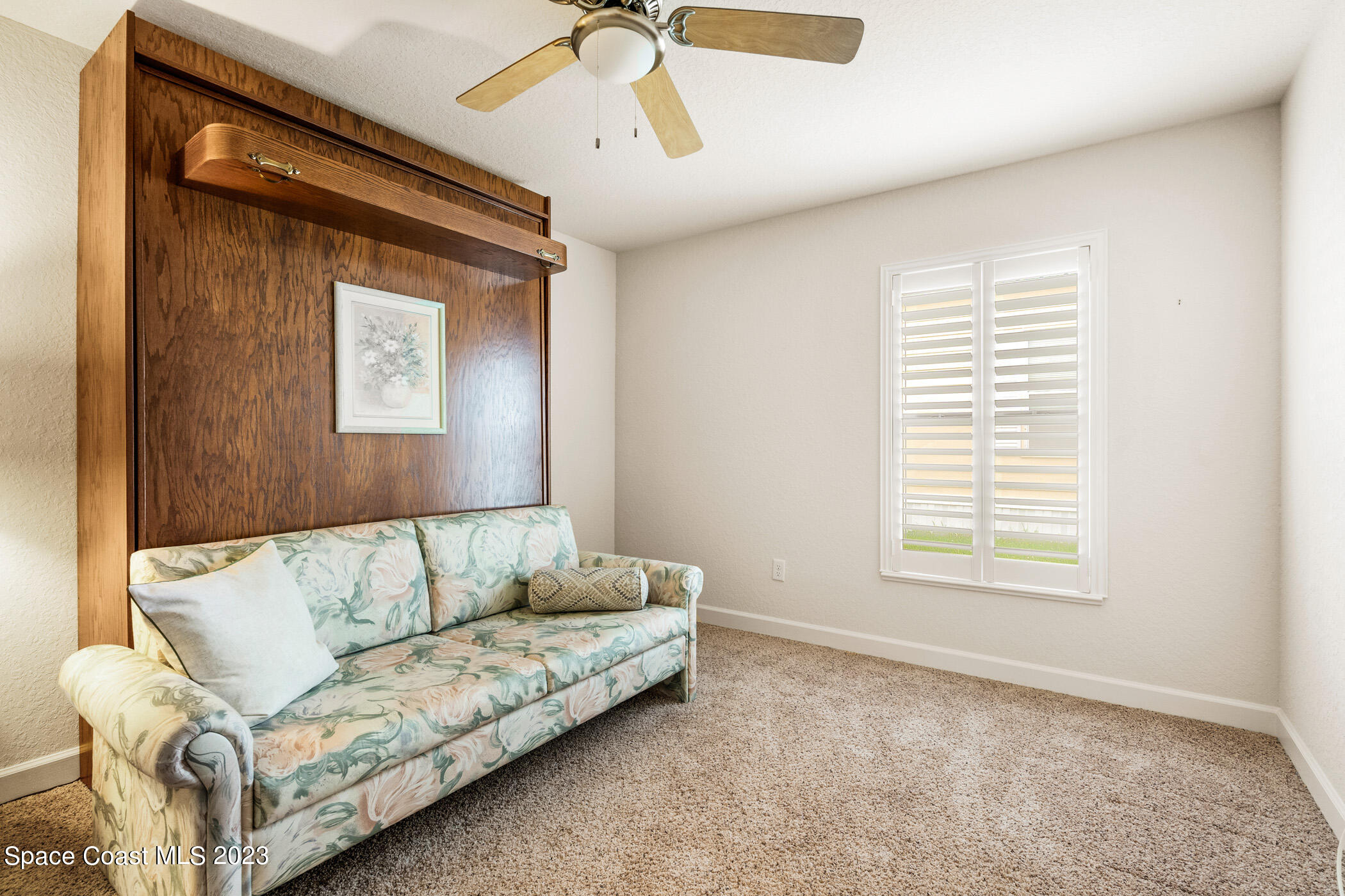 8 Danzar Fort Pierce, FL 34951 - Photo 16 of 31 a living room with furniture and a window