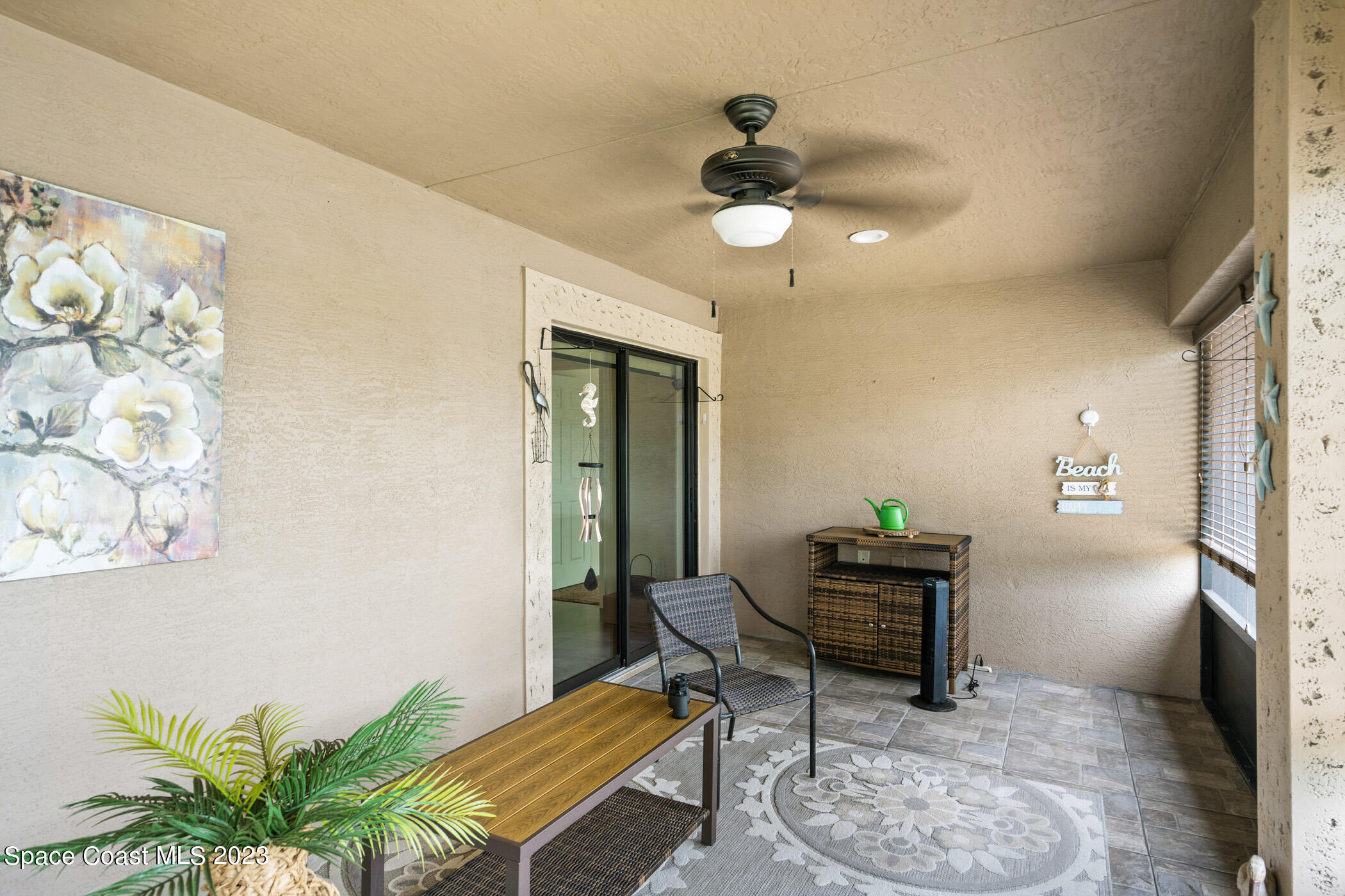 8 Danzar Fort Pierce, FL 34951 - Photo 20 of 31 a living room with furniture and a potted plant