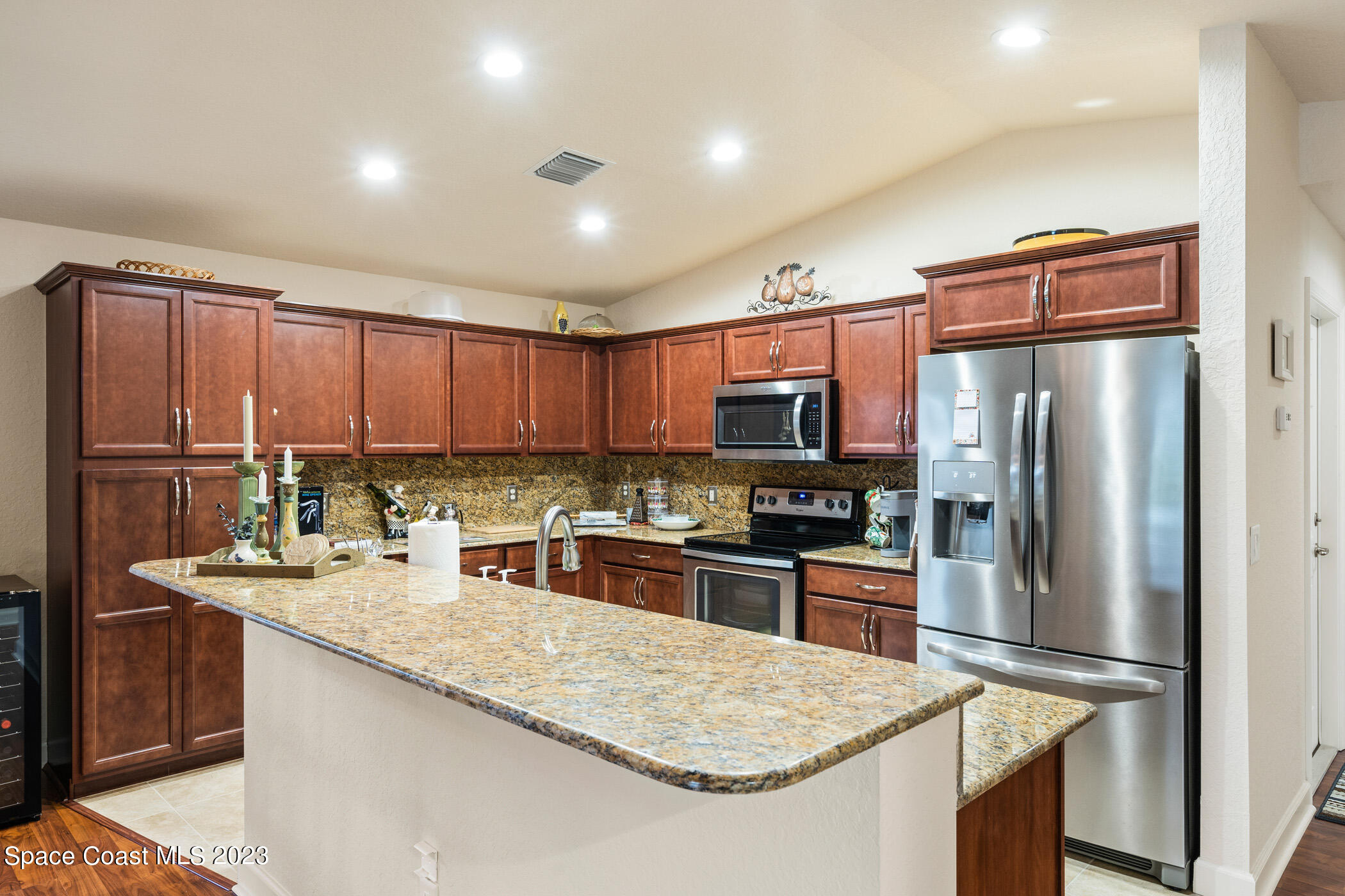 8 Danzar Fort Pierce, FL 34951 - Photo 2 of 31 a kitchen with stainless steel appliances granite countertop a refrigerator stove microwave and sink