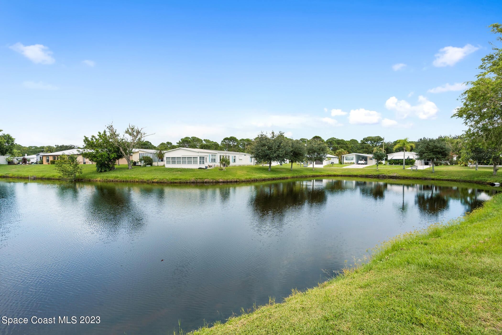 8 Danzar Fort Pierce, FL 34951 - Photo 22 of 31 a view of a lake with houses in the back