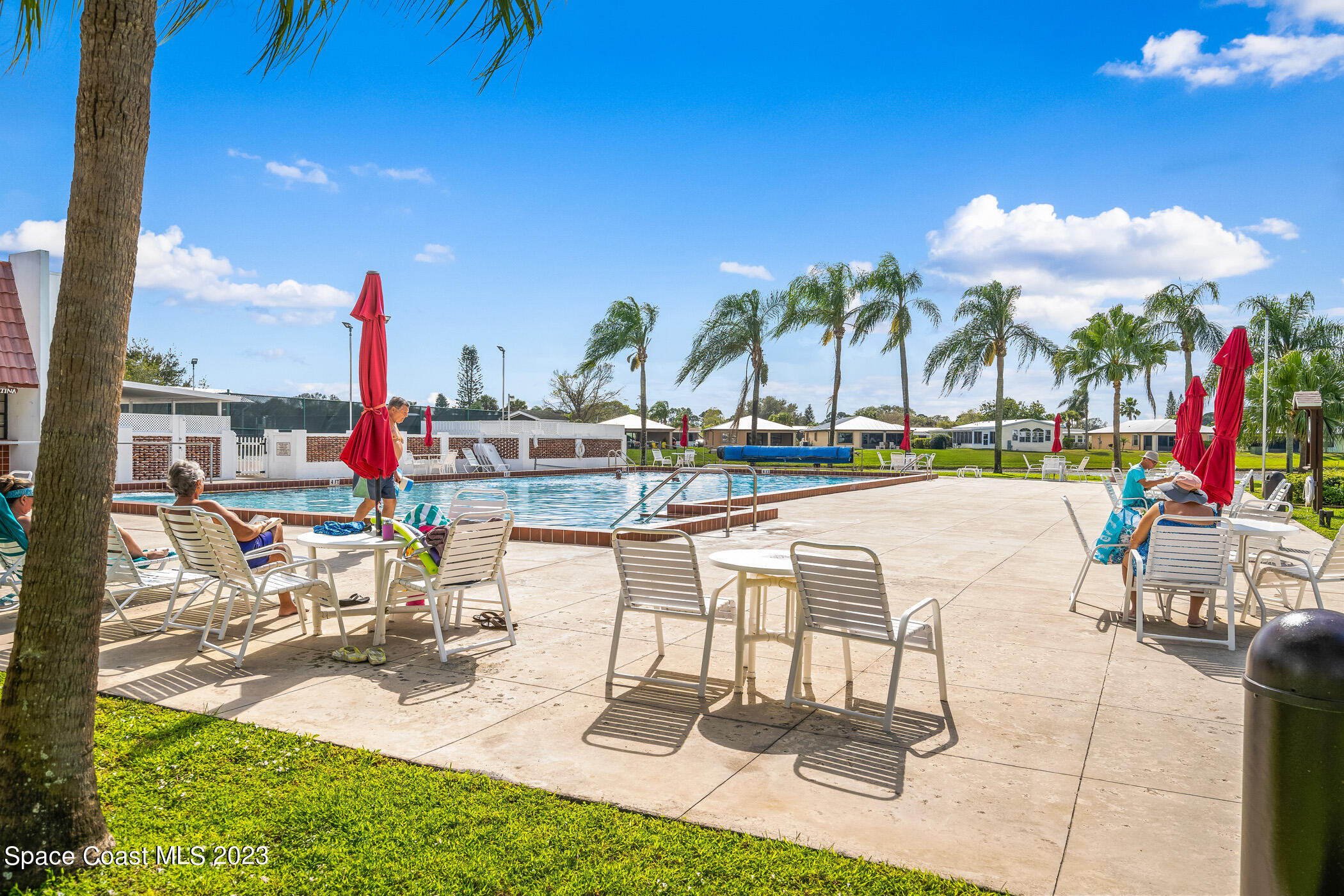 8 Danzar Fort Pierce, FL 34951 - Photo 24 of 31 a view of swimming pool with outdoor seating and city view