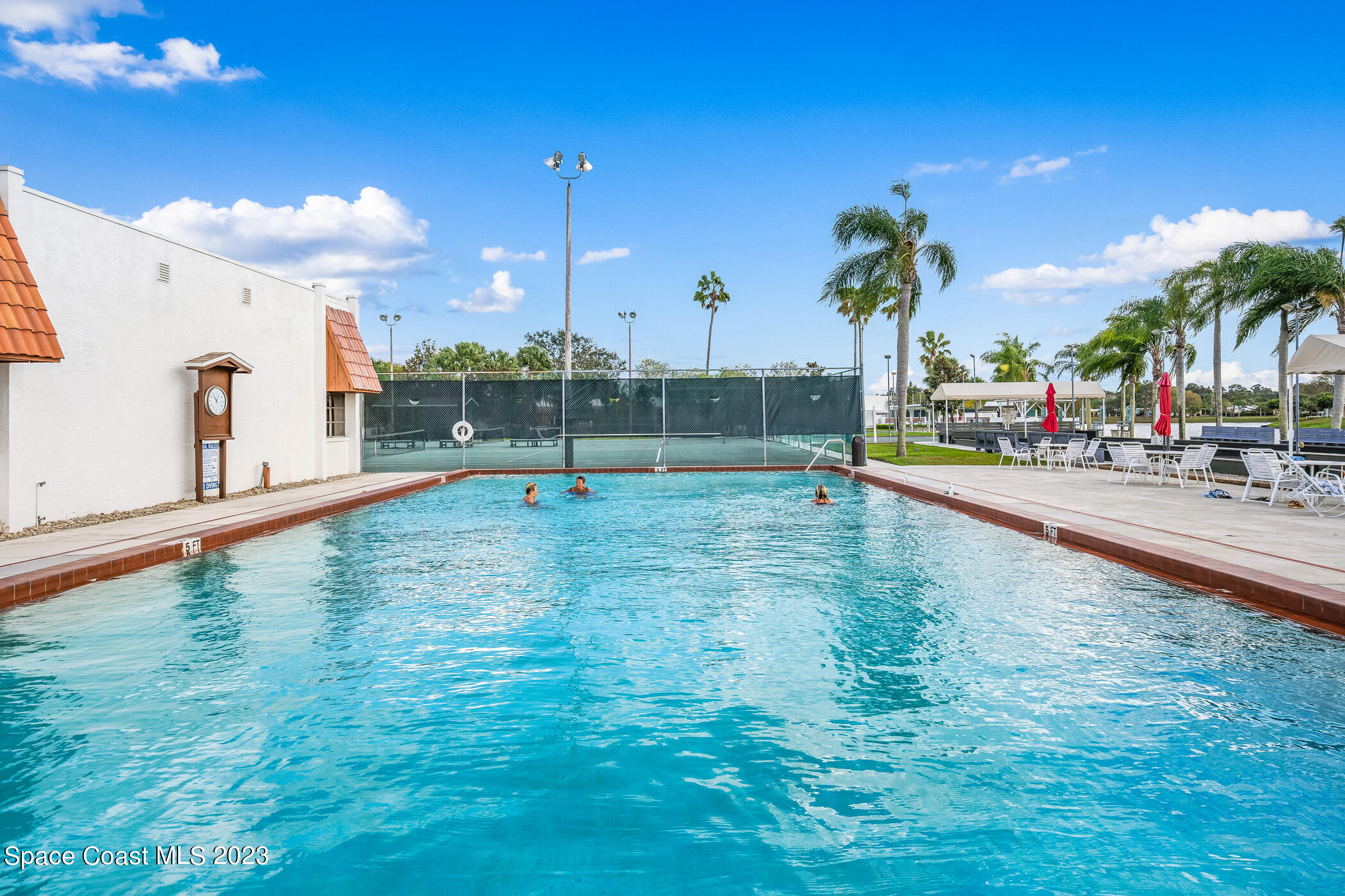 8 Danzar Fort Pierce, FL 34951 - Photo 25 of 31 a swimming pool with outdoor seating and yard