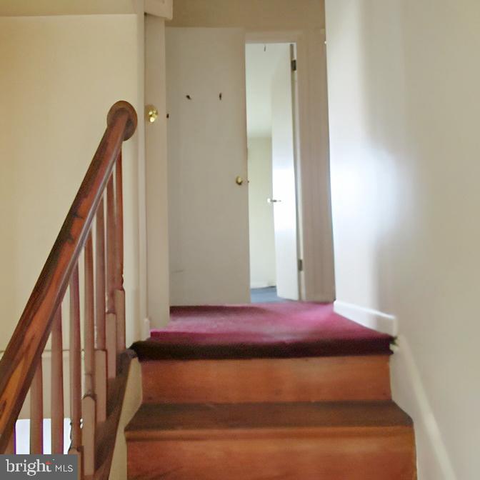 718 Mayo Road Glen Burnie, MD 21061 - Photo 36 of 48 Inviting staircase leading to new possibilities.