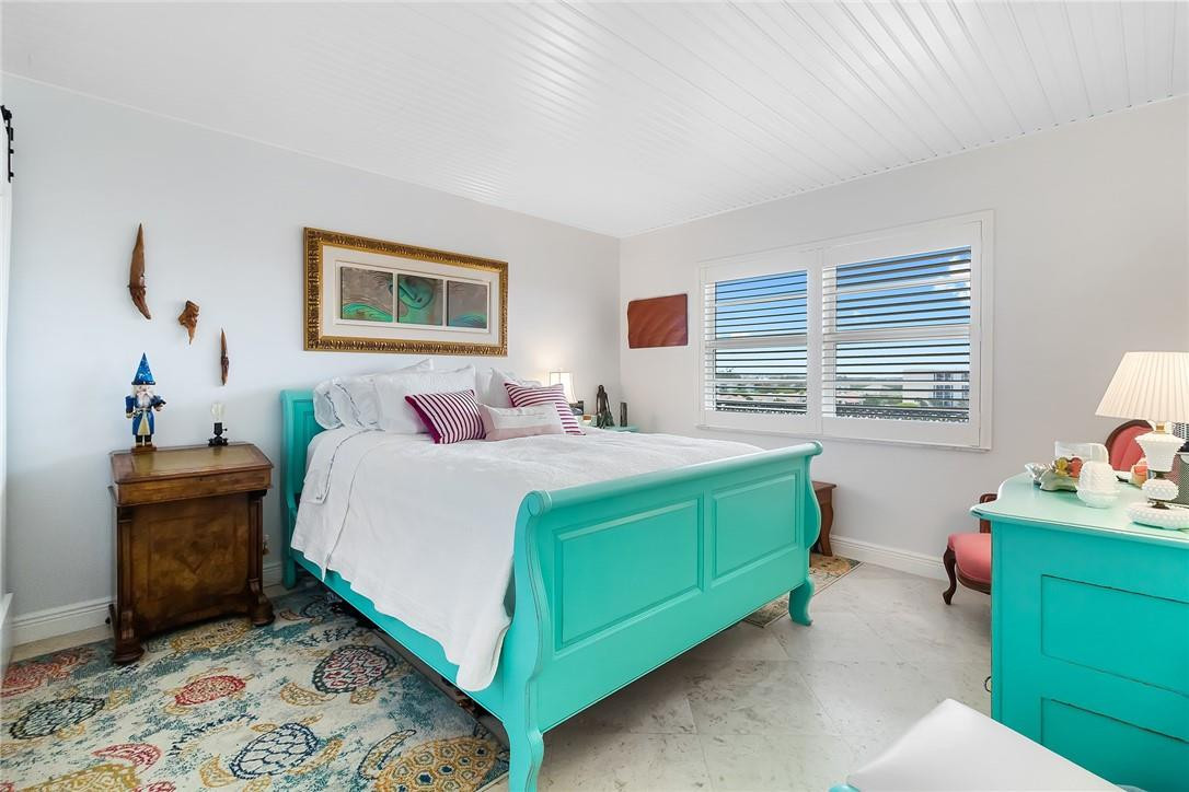 2871 North Ocean Boulevard, Unit D518 Boca Raton, FL 33431 - Photo 12 of 28 a bedroom with a bed and a dresser in it