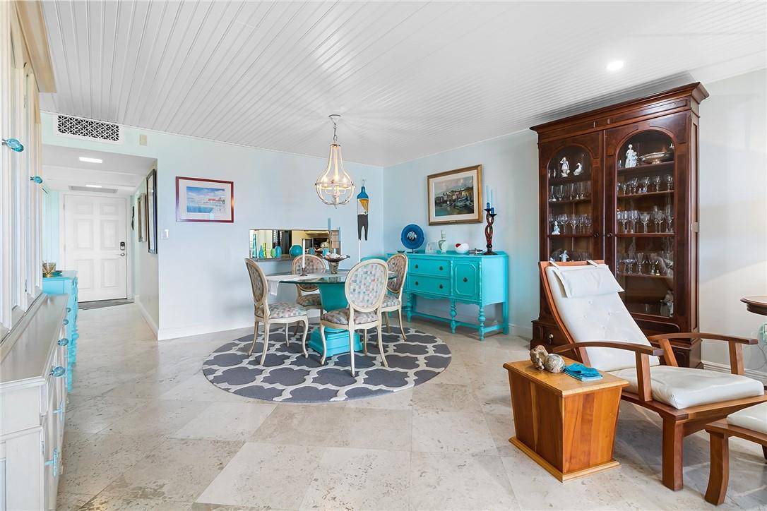 2871 North Ocean Boulevard, Unit D518 Boca Raton, FL 33431 - Photo 10 of 28 a living room with furniture and a large window