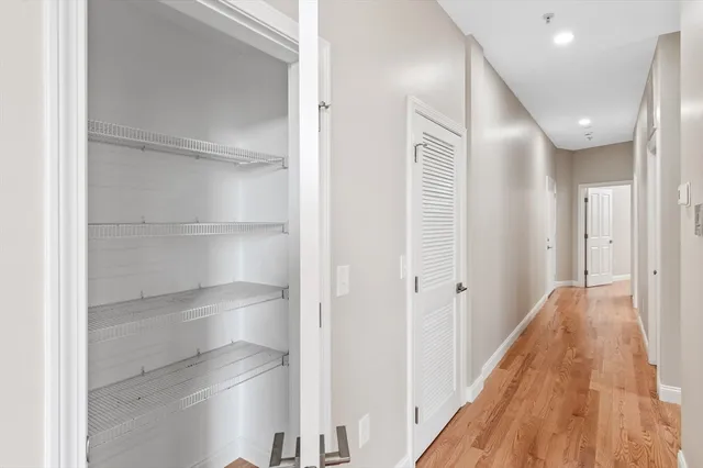a view of room with window and hardwood floor