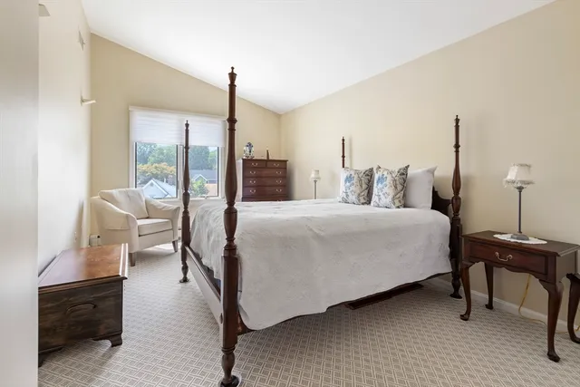 a bedroom with a bed and a desk