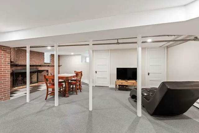 a view of a livingroom with furniture and a flat screen tv