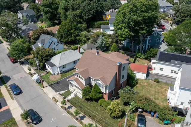 an aerial view of a house with a garden