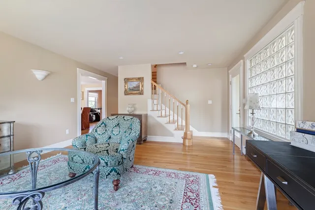 a view of a livingroom with furniture window and wooden floor