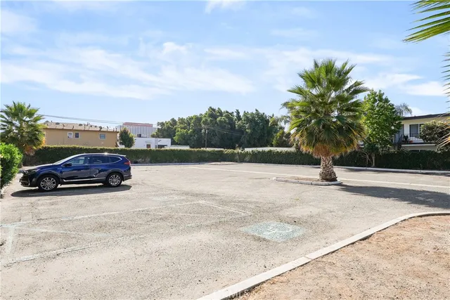 a view of a street with a building in the background