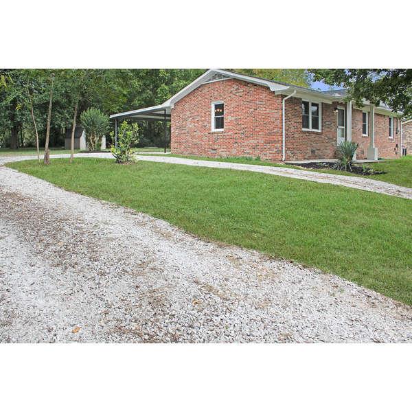 708 South Spring Street Manchester, TN 37355 - Photo 2 of 25 Left property line showing circle drive.