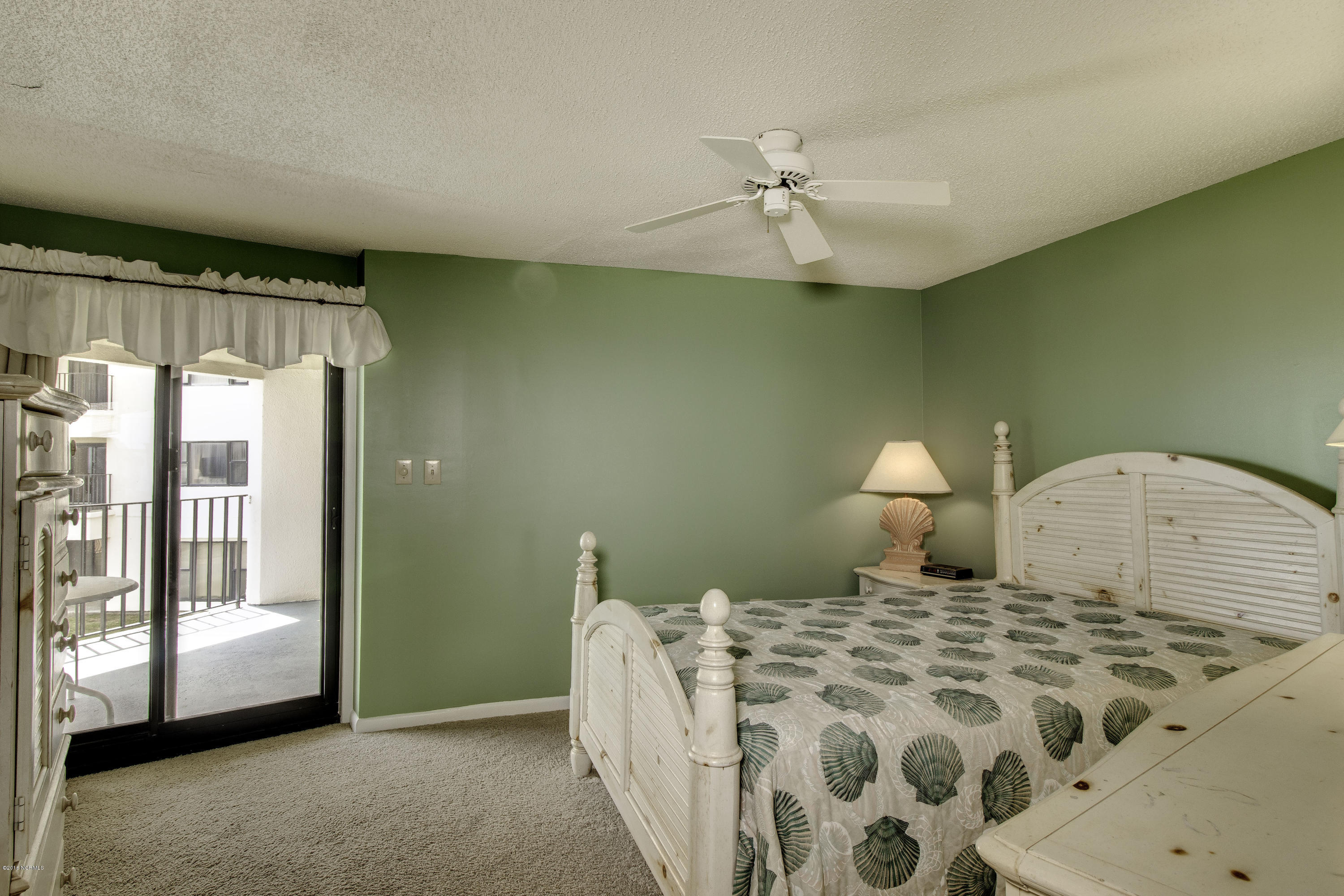 1505 Salter Path Road, Unit 239 Indian Beach, NC 28512 - Photo 12 of 16 Master bedroom with walk out to deck, walk in closet and full bath.