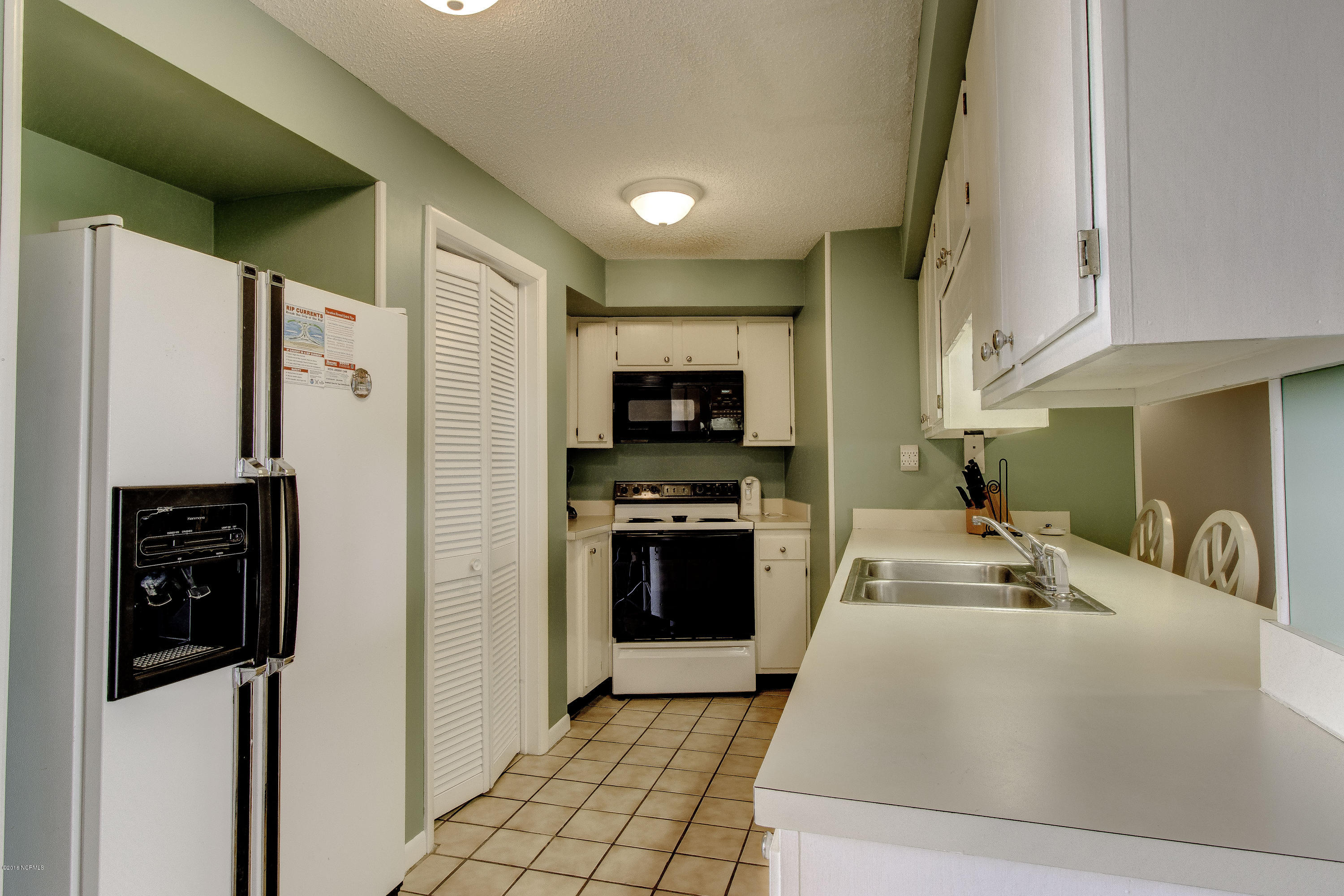 1505 Salter Path Road, Unit 239 Indian Beach, NC 28512 - Photo 4 of 16 Washer/Dryer is in closet off kitchen