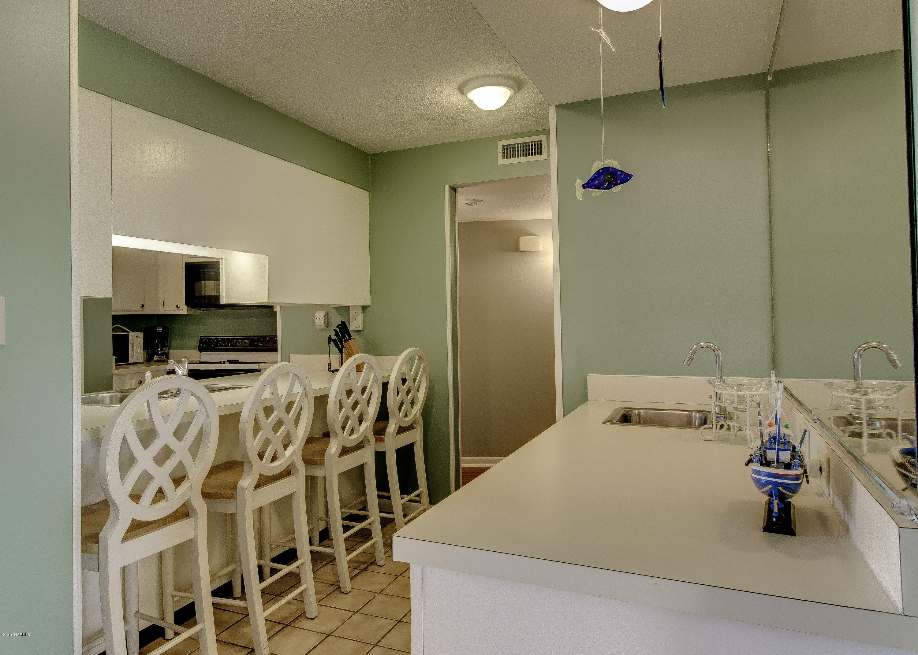 1505 Salter Path Road, Unit 239 Indian Beach, NC 28512 - Photo 5 of 16 Wet bar with ice maker