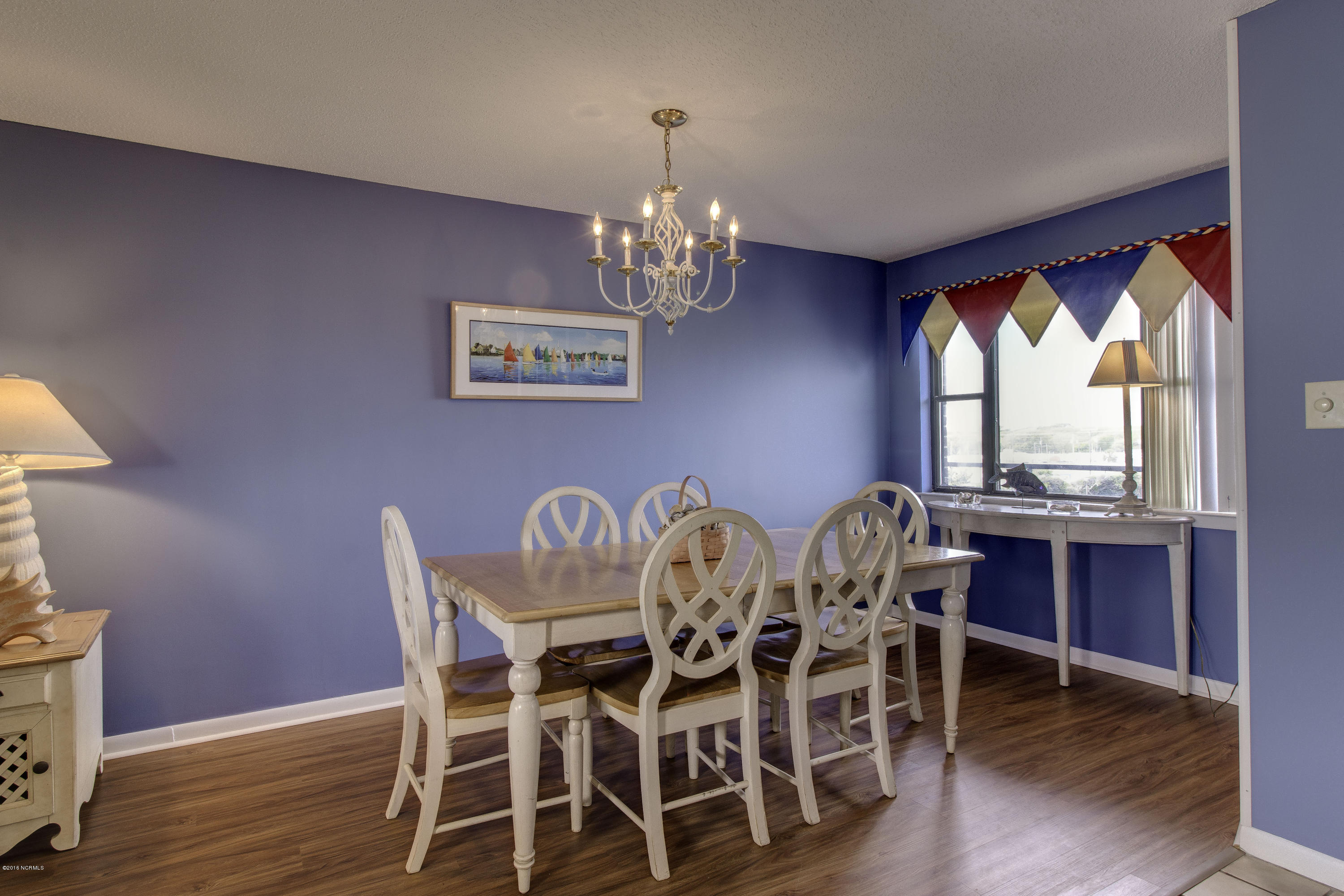1505 Salter Path Road, Unit 239 Indian Beach, NC 28512 - Photo 6 of 16 Dining area - laminate hardwood flooring in dining & living area.