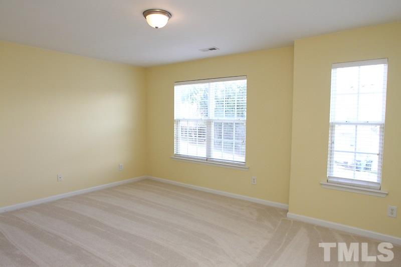 8419 Reedy Ridge Lane Raleigh, NC 27613 - Photo 11 of 20 a view of an empty room with a window