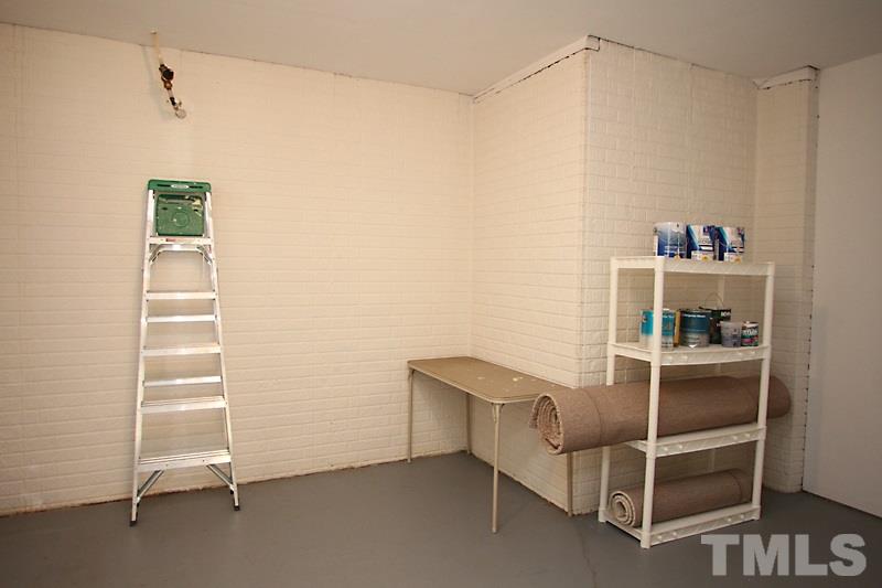 8419 Reedy Ridge Lane Raleigh, NC 27613 - Photo 16 of 20 a room with table and white walls