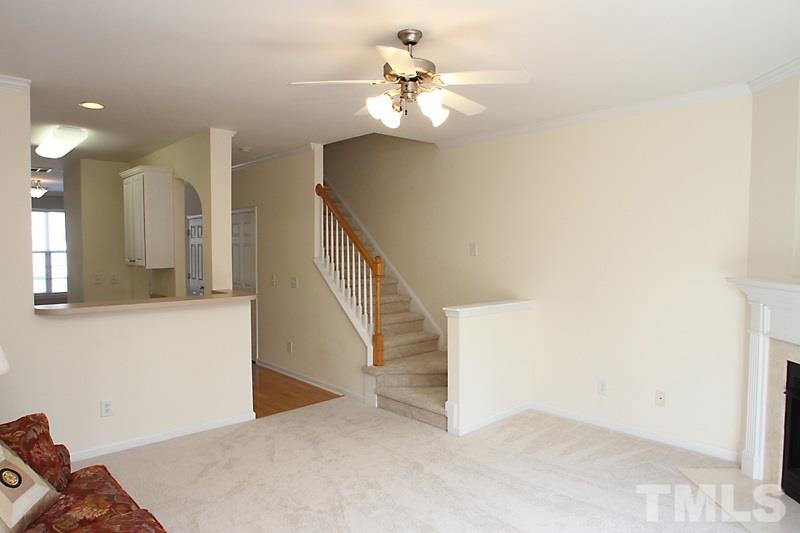 8419 Reedy Ridge Lane Raleigh, NC 27613 - Photo 3 of 20 a view of a hallway with staircase