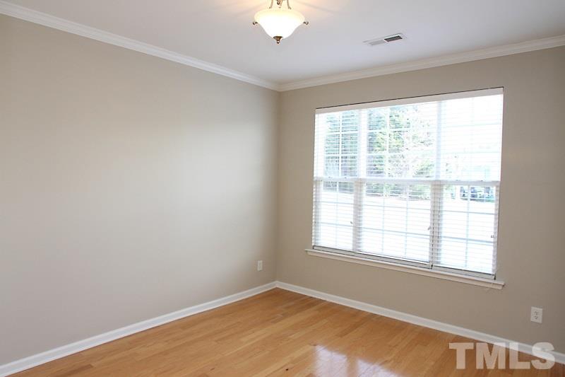 8419 Reedy Ridge Lane Raleigh, NC 27613 - Photo 4 of 20 an empty room with a window