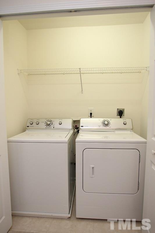 8419 Reedy Ridge Lane Raleigh, NC 27613 - Photo 7 of 20 a utility room with dryer and washer